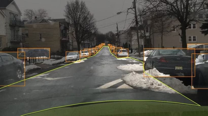 Road scene with lane polylines, road edges and vehicles annotated